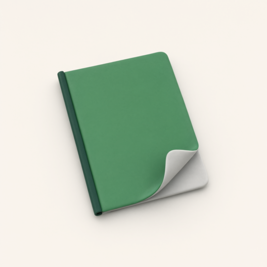 Green hardcover notebook with curled page corner on beige background
